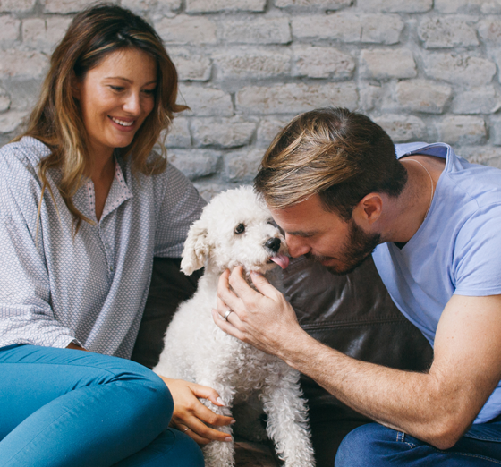 woman smiling holding a tablet